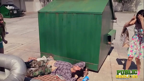 PUBLIC HANDJOBS Raquel Roper and Jessie Young give a homeless guy a hand