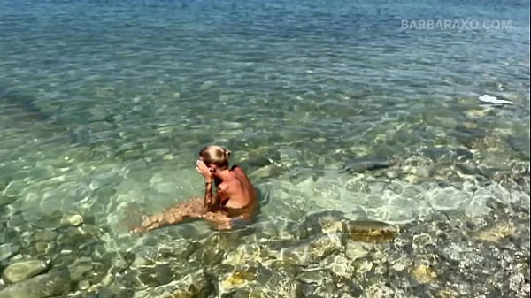 Slender tanned blonde gets fucked on the beach by the sound of waves during a photo shoot