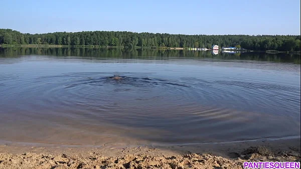 Naked girl goes skinny dipping in public beach