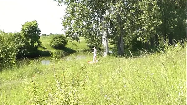 Milf sexy woman sunbathing naked on river bank. Random guy is watching. Naked in public. Public. Publicly. Wild beach Nudist. Perfect ass. Pussy. Blonde. Doggystyle. Woman got into doggy style position. Outdoor. Outside. Outdoors. Nudists. Naturist. POV