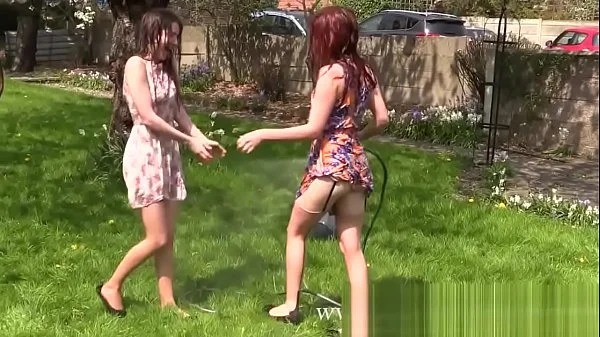 Two Girls get wet in Garden and Strip