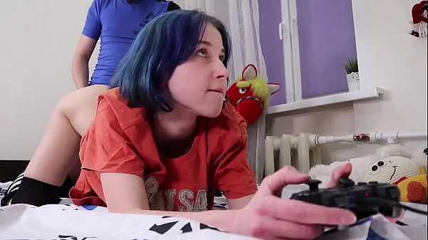 Fucks a teen while she plays the console -real orgasm